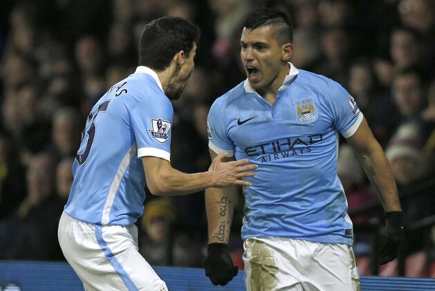 Manchester City's Argentinian striker Sergio Aguero celebrates with Manchester City's Spanish midfielder Jesus Navas (L) after scoring their second goal during the English Premier League football match between Watford and Manchester City at Vicarage Road Stadium in Watford, north of London on January 2, 2016. AFP PHOTO / ADRIAN DENNIS

RESTRICTED TO EDITORIAL USE. NO USE WITH UNAUTHORIZED AUDIO, VIDEO, DATA, FIXTURE LISTS, CLUB/LEAGUE LOGOS OR 'LIVE' SERVICES. ONLINE IN-MATCH USE LIMITED TO 75 IMAGES, NO VIDEO EMULATION. NO USE IN BETTING, GAMES OR SINGLE CLUB/LEAGUE/PLAYER PUBLICATIONS. / AFP / ADRIAN DENNIS        (Photo credit should read ADRIAN DENNIS/AFP/Getty Images)