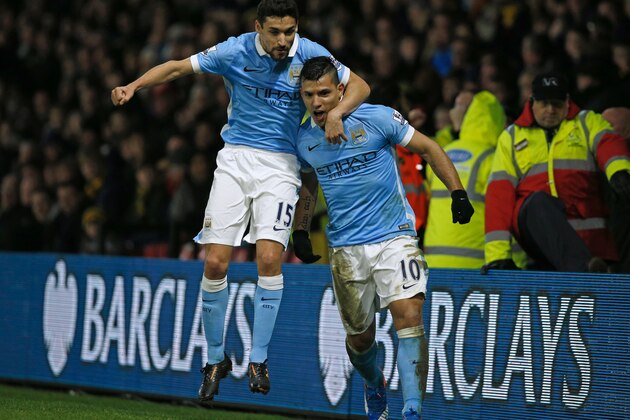 Manchester City's Argentinian striker Sergio Aguero celebrates with Manchester City's Spanish midfielder Jesus Navas (L) after scoring their second goal during the English Premier League football match between Watford and Manchester City at Vicarage Road Stadium in Watford, north of London on January 2, 2016. AFP PHOTO / ADRIAN DENNIS

RESTRICTED TO EDITORIAL USE. NO USE WITH UNAUTHORIZED AUDIO, VIDEO, DATA, FIXTURE LISTS, CLUB/LEAGUE LOGOS OR 'LIVE' SERVICES. ONLINE IN-MATCH USE LIMITED TO 75 IMAGES, NO VIDEO EMULATION. NO USE IN BETTING, GAMES OR SINGLE CLUB/LEAGUE/PLAYER PUBLICATIONS. / AFP / ADRIAN DENNIS        (Photo credit should read ADRIAN DENNIS/AFP/Getty Images)