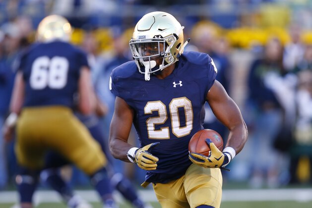 Notre Dame running back C.J. Prosise (20) runs the ball against Navy during the second half of an NCAA college football game, Saturday, Oct. 10, 2015, in South Bend, Ind. Notre Dame won the game 41-24. (AP Photo/Jeff Haynes)