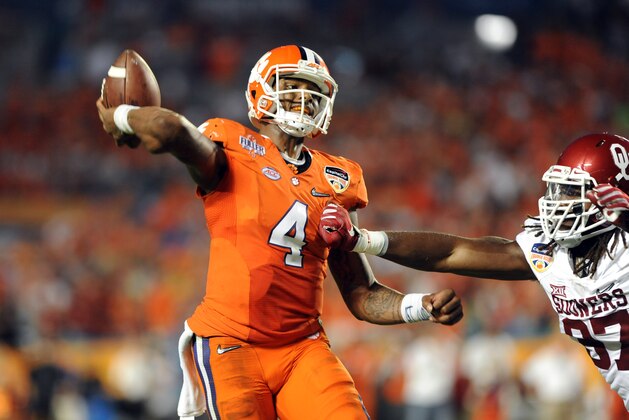 Dec 31, 2015; Miami Gardens, FL, USA; Clemson Tigers quarterback Deshaun Watson (4) throws against Oklahoma Sooners defensive end D.J. Ward (87) during the second quarter of the 2015 CFP semifinal at the Orange Bowl at Sun Life Stadium. Mandatory Credit: Robert Duyos-USA TODAY Sports