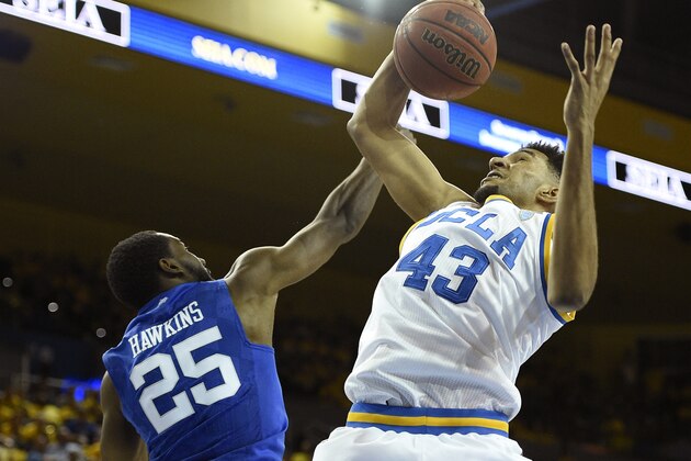 UCLA guard Jonah Bolden, right, grabs a rebound in front of Kentucky guard Dominique Hawkins during the second half of an NCAA college basketball game in Los Angeles, Thursday, Dec. 3, 2015. UCLA won 87-77. (AP Photo/Kelvin Kuo)