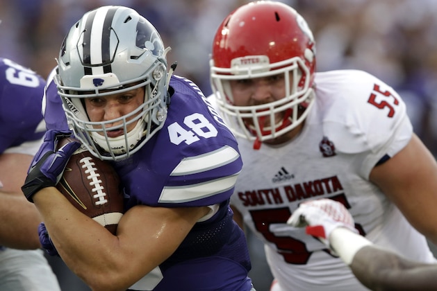 Kansas State fullback Glenn Gronkowski (48) breaks away from South Dakota defensive lineman Sean Bredl (55) during the first half of an NCAA college football game in Manhattan, Kan., Saturday, Sept. 5, 2015. (AP Photo/Orlin Wagner)