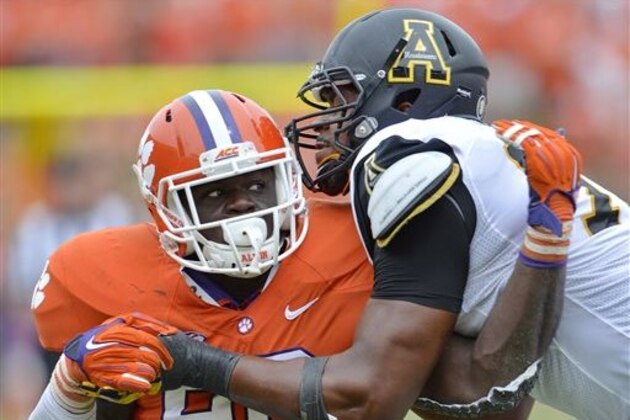 FILE - In this Sept. 12, 2015, file photo, Clemson's Shaq Lawson (90) rushes against Appalachian State's Davante Harris during the second half of an NCAA college football game in Clemson, S.C. Before the Atlantic Coast Conference defensive player of the year takes for the field for your favorite pro team next season, watch the 6-foot-3, 275-pound standout at his dominant best when the Tigers face Oklahoma in the College Football Playoff semifinals on New Year’s Eve.  (AP Photo/Richard Shiro, File)