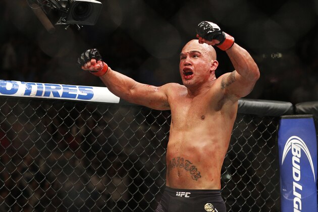 Robbie Lawler celebrates after defeating Rory MacDonald in their welterweight title mixed martial arts bout at UFC 189 on Saturday, July 11, 2015, in Las Vegas. (AP Photo/John Locher)