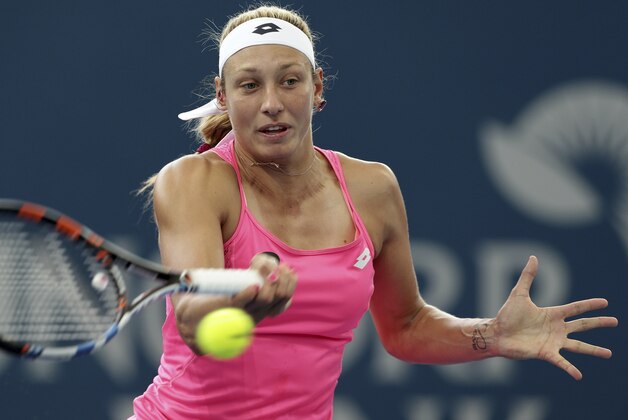 Yanina Wickmayer of Belgium plays shot in her match against Dominika Cibulkova of Slovakia during the Brisbane International tennis tournament in Brisbane, Australia, Sunday, Jan. 3, 2016. (AP Photo/Tertius Pickard)