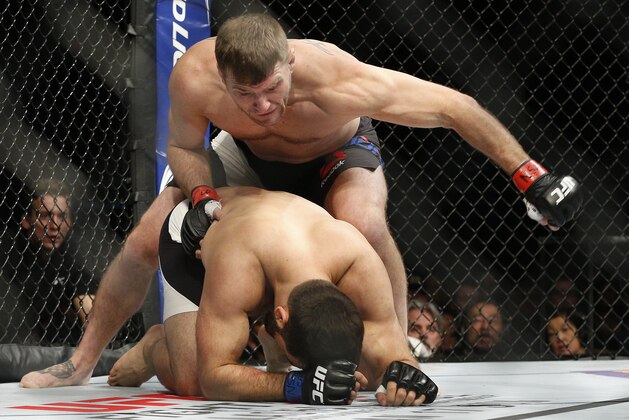 Stipe Miocic, top, fights Andrei Arlovski in a heavyweight mixed martial arts bout at UFC 195, Saturday, Jan. 2, 2016, in Las Vegas. (AP Photo/John Locher)