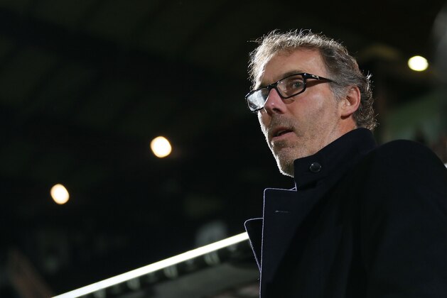 Paris Saint Germain's head coach Laurent Blanc reacts at the start of his French League One soccer match against Angers, Tuesday, Dec. 1, 2015, in Angers, western France. (AP Photo/David Vincent)