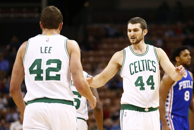 Oct 23, 2015; Manchester, NH, USA; Boston Celtics center Tyler Zeller (44) and forward David Lee (42) celebrate against the Philadelphia 76ers during the first half at Verizon Wireless Arena. Mandatory Credit: Mark L. Baer-USA TODAY Sports