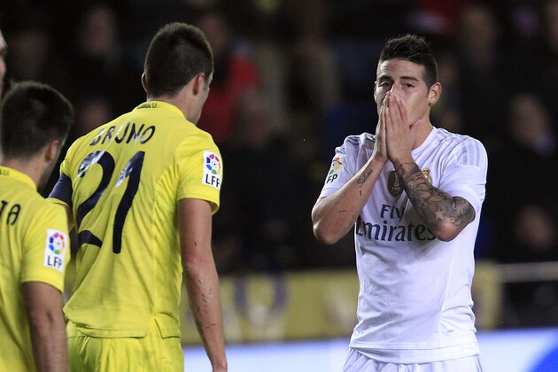 Real Madrid's James Rodriguez, right, reacts after failing to score against Villarreal during a Spanish La Liga soccer match at the Madrigal stadium in Villarreal, Spain, Sunday, Dec. 13, 2015. (AP Photo/Alberto Saiz)