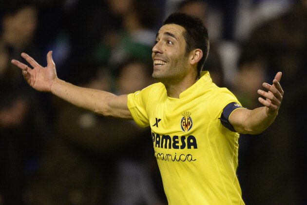 Villarreal's midfielder Bruno Soriano celebrates after scoring a penalty during the Spanish league football match RC Deportivo de la Coruna vs Villarreal CF at the Municipal de Riazor stadium in La Coruna on January 3, 2016.  Villarreal won the match 2-1.  AFP PHOTO/ MIGUEL RIOPA / AFP / MIGUEL RIOPA        (Photo credit should read MIGUEL RIOPA/AFP/Getty Images)