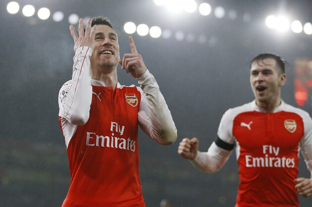 Arsenal's Laurent Koscielny celebrates scoring a goal during the English Premier League soccer match between Arsenal and Newcastle United at Emirates stadium in London, Saturday, Jan. 2, 2016. (AP Photo/Kirsty Wigglesworth)