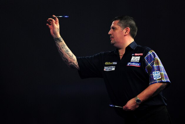 LONDON, ENGLAND - JANUARY 03:  Gary Anderson of Scotland throws during the final match against Adrian Lewis of England during Day Fifteen of the 2016 William Hill PDC World Darts Championships at Alexandra Palace on January 3, 2016 in London, England.  (Photo by Dan Mullan/Getty Images)