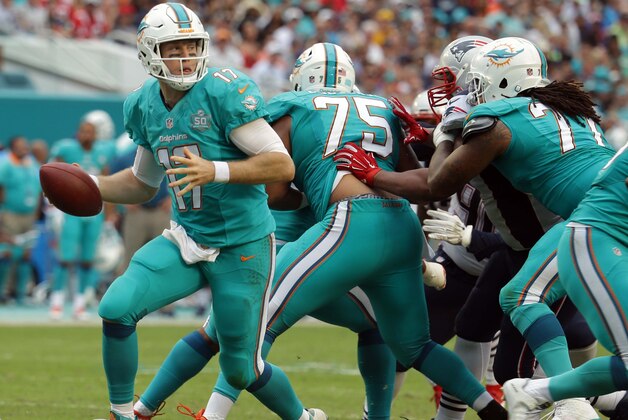 Miami Dolphins quarterback Ryan Tannehill (17) looks to pass during the second half of an NFL football game against the New England Patriots, Sunday, Jan. 3, 2016, in Miami Gardens, Fla. (AP Photo/Lynne Sladky)