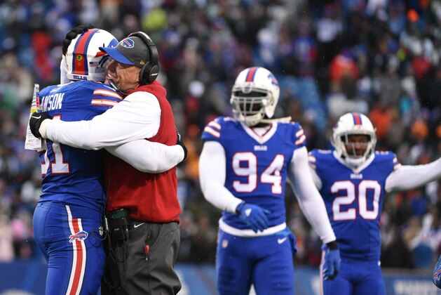 Buffalo Bills head coach Rex Ryan hugs Buffalo Bills' Manny Lawson (91) after Lawson intercepted a pass during the second half of an NFL football game against the New York Jets Sunday, Jan. 3, 2016, in Orchard Park, N.Y. The Bills won 22-17. (AP Photo/Gary Wiepert)