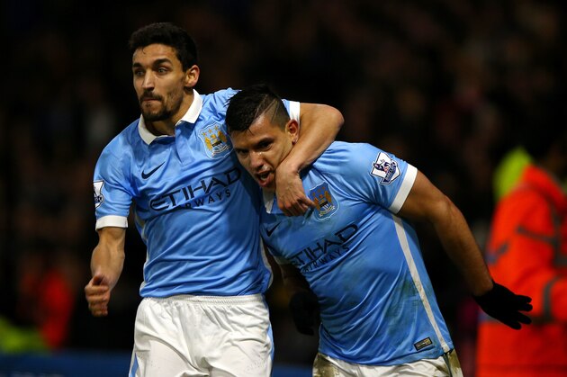 WATFORD, ENGLAND - JANUARY 02:  Sergio Aguero of Manchester City (r) celebrates with Jesus Navas of Manchester City after scoring his side's second goal during the Barclays Premier League match between Watford and Manchester City at Vicarage Road on January 2, 2016 in Watford, England.  (Photo by Ian Walton/Getty Images)