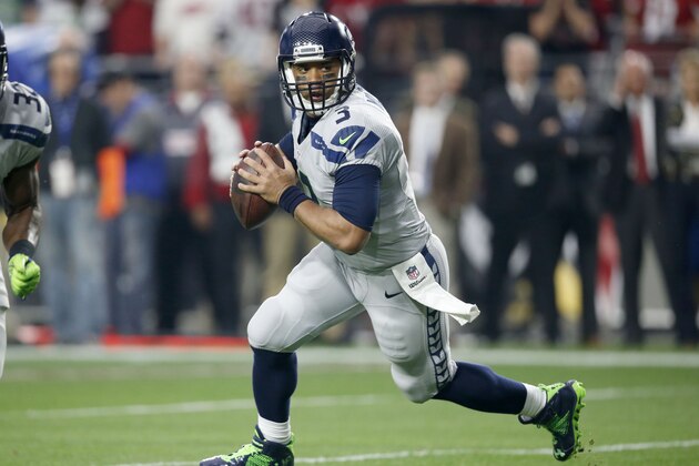 Seattle Seahawks quarterback Russell Wilson (3) scrambles against the Arizona Cardinals during the first half of an NFL football game, Sunday, Jan. 3, 2016, in Glendale, Ariz. (AP Photo/Ross D. Franklin)