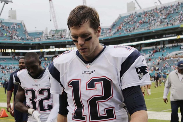 New England Patriots quarterback Tom Brady (12) leaves the field at the end of an NFL football game, Sunday, Jan. 3, 2016, in Miami Gardens, Fla. The Dolphins defeated the Patriots 20-10. (AP Photo/Lynne Sladky)