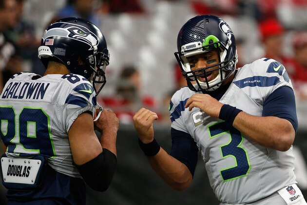 GLENDALE, AZ - JANUARY 03: Quarterback Russell Wilson #3 warms up with teamate wide receiver Doug Baldwin #89 of the Seattle Seahawks prior to the NFL game against the Arizona Cardinals at the University of Phoenix Stadium on January 3, 2016 in Glendale, Arizona. (Photo by Christian Petersen/Getty Images)