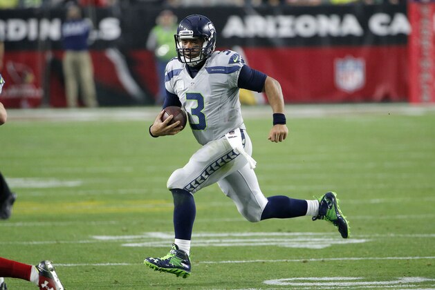 Seattle Seahawks quarterback Russell Wilson (3) scrambles against the Arizona Cardinals during the second half of an NFL football game, Sunday, Jan. 3, 2016, in Glendale, Ariz. (AP Photo/Ross D. Franklin)