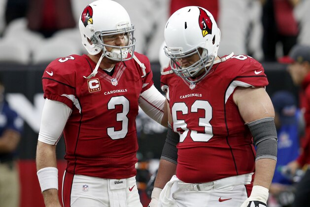 Arizona Cardinals quarterback Carson Palmer (3) talks with center Lyle Sendlein (63) prior to an NFL football game against the Seattle Seahawks, Sunday, Jan. 3, 2016, in Glendale, Ariz. (AP Photo/Rick Scuteri)