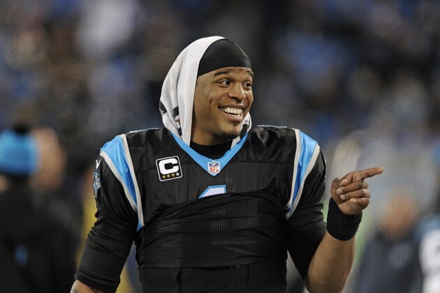 Carolina Panthers quarterback Cam Newton (1) celebrates on the sidelines late in the second half of an NFL football game against the Tampa Bay Buccaneersin Charlotte, N.C., Sunday, Jan. 3, 2016. The Panthers won 38-10. (AP Photo/Mike McCarn)