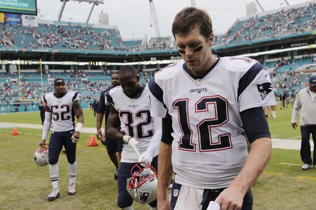 New England Patriots quarterback Tom Brady (12) leaves the field at the end of an NFL football game, Sunday, Jan. 3, 2016, in Miami Gardens, Fla. The Dolphins defeated the Patriots 20-10. (AP Photo/Lynne Sladky)