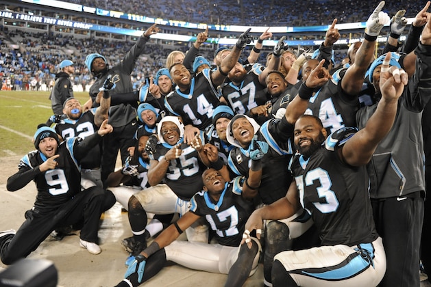 Carolina Panthers players celebrate late in the second half of an NFL football game against the Tampa Bay Buccaneers in Charlotte, N.C., Sunday, Jan. 3, 2016. The Panthers won 38-10. (AP Photo/Mike McCarn)