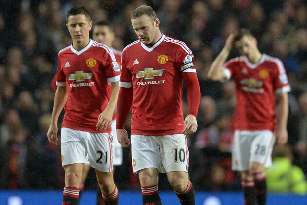 Manchester United's English striker Wayne Rooney (2nd R) and Manchester United's Spanish midfielder Ander Herrera (L) react after conceding a goal  during the English Premier League football match between Manchester United and Swansea City at Old Trafford in Manchester, north west England, on January 2, 2016. Manchester United won the game 2-1. AFP PHOTO / OLI SCARFF

RESTRICTED TO EDITORIAL USE. No use with unauthorized audio, video, data, fixture lists, club/league logos or 'live' services. Online in-match use limited to 75 images, no video emulation. No use in betting, games or single club/league/player publications. / AFP / OLI SCARFF        (Photo credit should read OLI SCARFF/AFP/Getty Images)