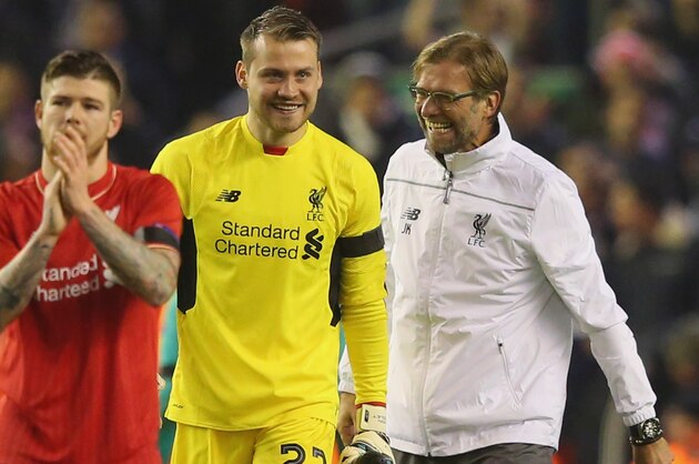 LIVERPOOL, ENGLAND - NOVEMBER 26:  Jurgen Klopp manager of Liverpool jokes with Simon Mignolet of Liverpool after victory in the UEFA Europa League Group B match between Liverpool FC and FC Girondins de Bordeaux at Anfield on November 26, 2015 in Liverpool, United Kingdom.  (Photo by Alex Livesey/Getty Images)