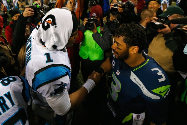SEATTLE, WA - JANUARY 10:  Russell Wilson #3 of the Seattle Seahawks shakes hands with Cam Newton #1 of the Carolina Panthers after their 2015 NFC Divisional Playoff game at CenturyLink Field on January 10, 2015 in Seattle, Washington. The Seattle Seahawks defeated the Carolina Panthers 31 to 17.  (Photo by Jonathan Ferrey/Getty Images)