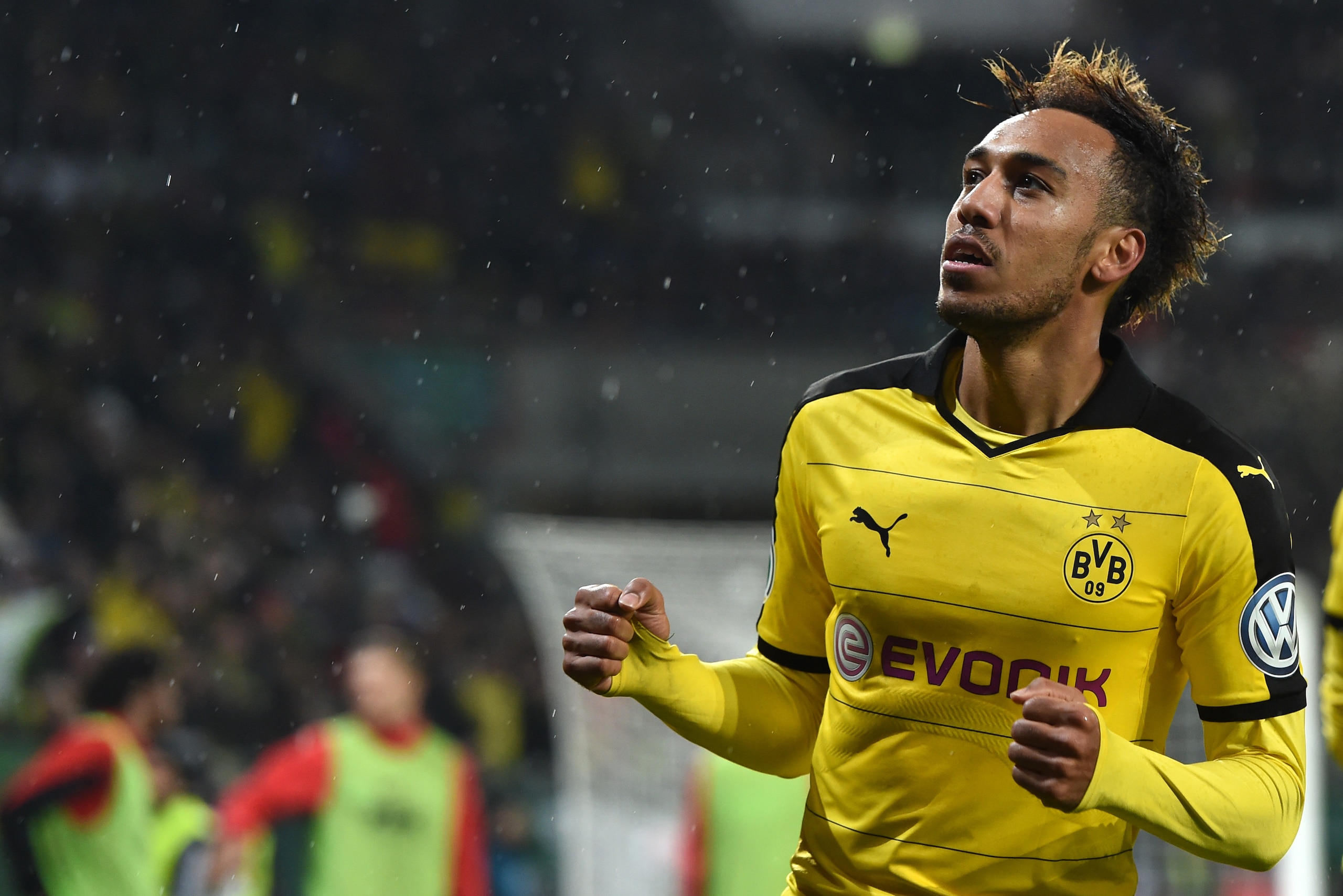 Dortmund's Gabonese striker Pierre-Emerick Aubameyang celebrates after his goal during the German Cup DFB Pokal third round match between Borussia Dortmund and FC Augsburg in Augsburg on December 16, 2015.  / AFP / Christof STACHE / RESTRICTIONS: ACCORDING TO DFB RULES IMAGE SEQUENCES TO SIMULATE VIDEO IS NOT ALLOWED DURING MATCH TIME. MOBILE (MMS) USE IS NOT ALLOWED DURING AND FOR FURTHER TWO HOURS AFTER THE MATCH. == RESTRICTED TO EDITORIAL USE == FOR MORE INFORMATION CONTACT DFB DIRECTLY AT +49 69 67880

 /         (Photo credit should read CHRISTOF STACHE/AFP/Getty Images)