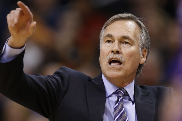 Los Angeles Lakers' Mike D'Antoni shouts instructions to his players during the first half of an NBA basketball game against the Phoenix Suns Monday, Dec. 23, 2013, in Phoenix.  The Suns defeated the Lakers 117-90. (AP Photo/Ross D. Franklin)