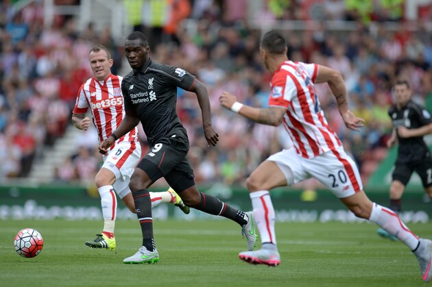 Liverpool's Zaire-born Belgian striker Christian Benteke (2nd L) runs with the ball during the English Premier League football match between Stoke City and Liverpool at the Britannia Stadium in Stoke-on-Trent, central England on August 9, 2015. AFP PHOTO / OLI SCARFF  RESTRICTED TO EDITORIAL USE. No use with unauthorized audio, video, data, fixture lists, club/league logos or 'live' services. Online in-match use limited to 75 images, no video emulation. No use in betting, games or single club/league/player publications..        (Photo credit should read OLI SCARFF/AFP/Getty Images)