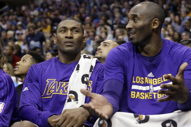 Los Angeles Lakers' Metta World Peace, left, and Los Angeles Lakers Kobe Bryant sit on the bench during the second half of an NBA basketball game against the Dallas Mavericks, Friday, Nov. 13, 2015, in Dallas. The Mavericks won 90-82. (AP Photo/LM Otero)
