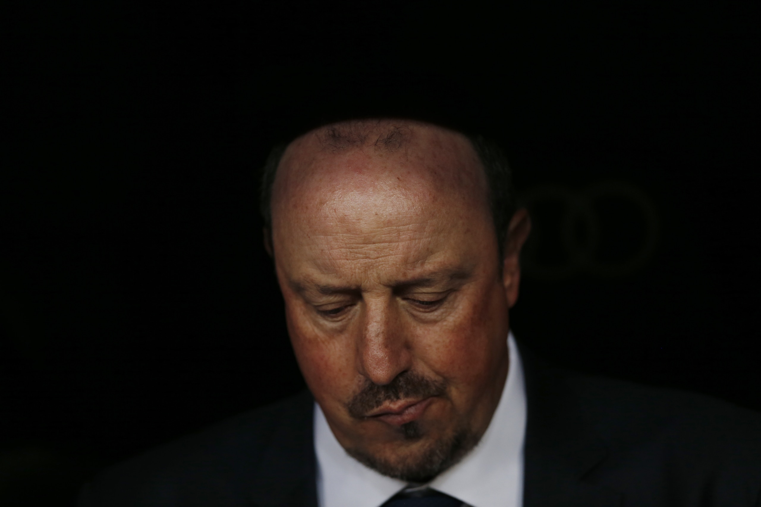 FILE - In this Nov. 21, 2015 file photo, Real Madrid's head coach Rafael Benitez sits on the bench before the first clasico of the season between Real Madrid and Barcelona at the Santiago Bernabeu stadium in Madrid, Spain. Real Madrid’s President Florentino Perez announced Monday Jan. 4, 2016 that current coach Rafael Benitez has been fired and former player and Real Madrid’s B team coach Zinedine Zidane will take over. Benitez, hired seven months ago, has been under pressure since a demoralising 4-0 home loss to Barcelona in November. The team won seven of nine matches since the defeat at the Bernabeu, but fans continued to call for Benitez's departure. (AP Photo/Daniel Ochoa de Olza, File)
