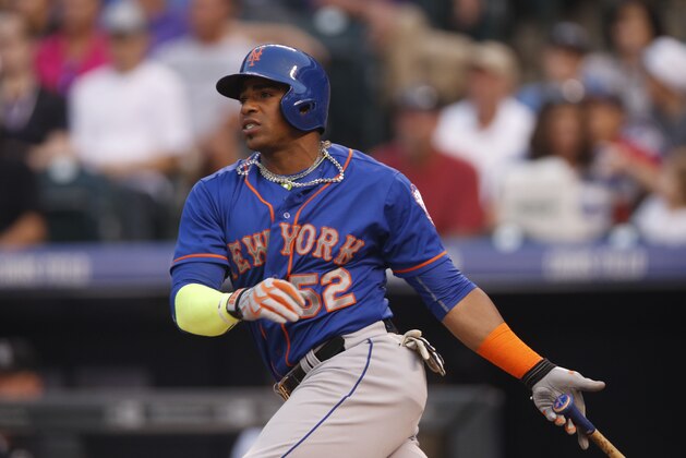 New York Mets center fielder Yoenis Cespedes (52) in the top of the third inning of a baseball game Saturday, Aug. 22, 2015, in Denver. (AP Photo/David Zalubowski)