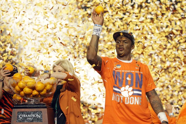 Clemson quarterback Deshaun Watson (4) throws oranges to the crowd after his team won the Orange Bowl NCAA college football semifinal playoff game against  Oklahoma, Thursday, Dec. 31, 2015, in Miami Gardens, Fla. Clemson defeated Oklahoma 37-17. (AP Photo/Joe Skipper)