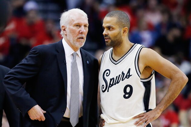 HOUSTON, TX - DECEMBER 25:  Head coach Gregg Popovich of the San Antonio Spurs chats with Tony Parker #9 during their game against the Houston Rockets at the Toyota Center on December 25, 2015 in Houston, Texas. NOTE TO USER: User expressly acknowledges and agrees that, by downloading and or using this Photograph, user is consenting to the terms and conditions of the Getty Images License Agreement.  (Photo by Scott Halleran/Getty Images)