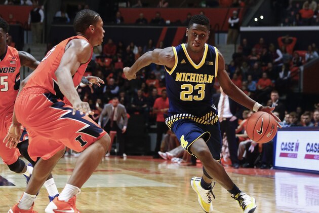 CHAMPAIGN, IL - DECEMBER 30: Caris LeVert #23 of the Michigan Wolverines brings the ball up court during the game against the Illinois Fighting Illini at State Farm Center on December 30, 2015 in Champaign, Illinois.  (Photo by Michael Hickey/Getty Images)