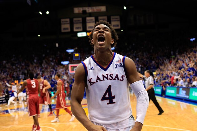 LAWRENCE, KS - JANUARY 04:  Devonte' Graham #4 of the Kansas Jayhawks celebrates as the Jayhawks defeat the Oklahoma Sooners 109-106 in triple overtime to win the game at Allen Fieldhouse on January 4, 2016 in Lawrence, Kansas.  (Photo by Jamie Squire/Getty Images)