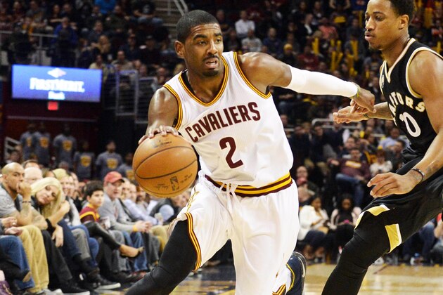 Jan 4, 2016; Cleveland, OH, USA; Cleveland Cavaliers guard Kyrie Irving (2) moves past Toronto Raptors guard DeMar DeRozan (10) during the fourth quarter at Quicken Loans Arena. The Cavs won 122-100. Mandatory Credit: Ken Blaze-USA TODAY Sports