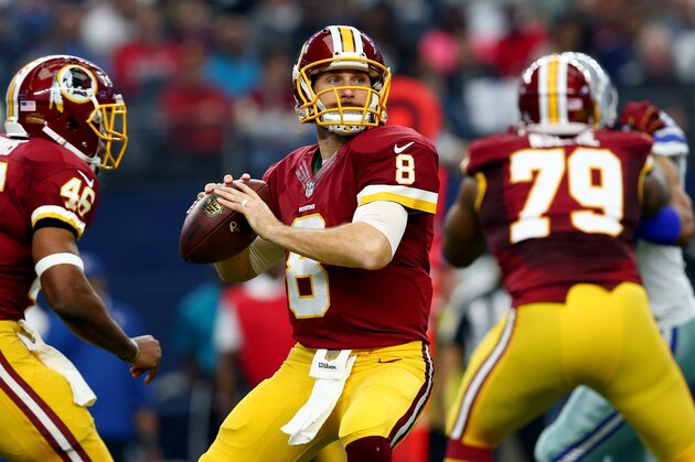 ARLINGTON, TX - JANUARY 03: Kirk Cousins #8 of the Washington Redskins looks for an open receiver against the Dallas Cowboys during the first quarter at AT&T Stadium on January 3, 2016 in Arlington, Texas. (Photo by Tom Pennington/Getty Images)