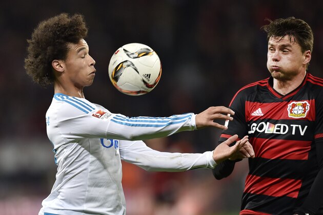 Schalke's Leroy Sane, left, and Leverkusen's Sebastian Boenisch, right, challenge for the ball during the German Bundesliga soccer match between Bayer 04 Leverkusen and FC Schalke 04 in Leverkusen, Germany, Sunday, Nov. 29, 2015. (AP Photo/Martin Meissner)
