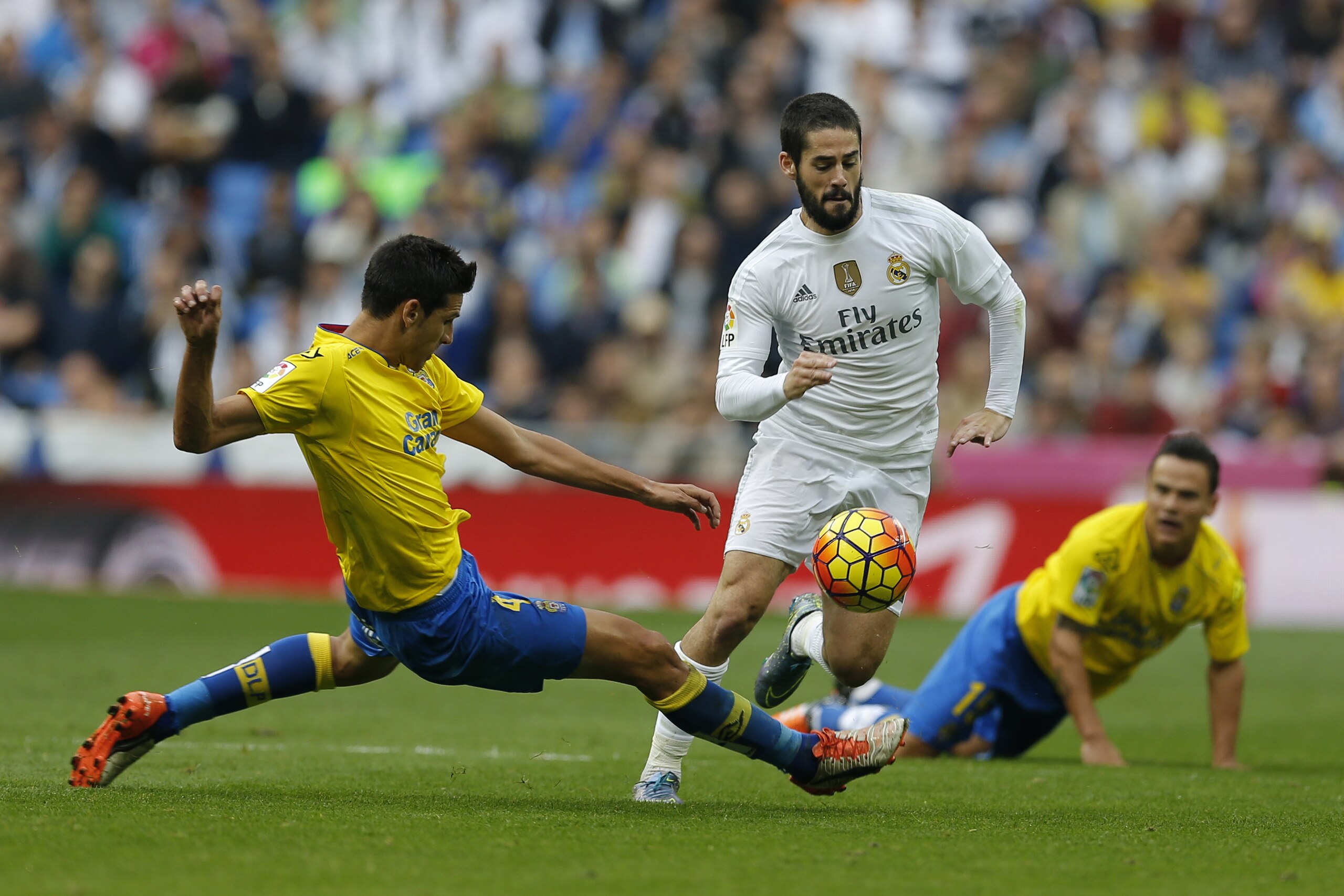 Real Madrid's Francisco Roman “Isco”, right, vies for the ball with Las Palmas' Vicente Gomez during the Spanish La Liga soccer match between Real Madrid and Las Palmas at the Santiago Bernabeu stadium in Madrid, Saturday, Oct. 31, 2015. Isco scored once in Real Madrid's 3-1 victory. (AP Photo/Francisco Seco) Real Madrid's Francisco Roman “Isco”, right, vies for the ball with Las Palmas' Vicente Gomez during the Spanish La Liga soccer match between Real Madrid and Las Palmas at the Santiago Bernabeu stadium in Madrid, Saturday, Oct. 31, 2015. Isco scored once in Real Madrid's 3-1 victory. (AP Photo/Francisco Seco)