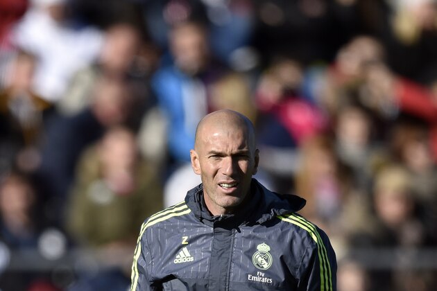 Real Madrid's new French coach Zinedine Zidane watches his players during his first training session as coach of Real Madrid at the Alfredo di Stefano stadium in Valdebebas, on the outskirts of Madrid, on January 5, 2016. Real Madrid legend Zinedine Zidane promised to put his 'heart and soul' into managing the Spanish giants after he was sensationally named as coach following Rafael Benitez's unceremonious sacking. AFP PHOTO/ GERARD JULIEN / AFP / GERARD JULIEN        (Photo credit should read GERARD JULIEN/AFP/Getty Images)