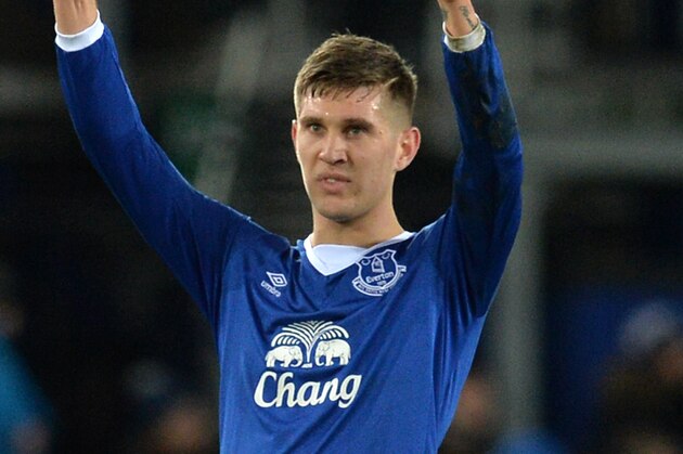 Everton's English defender John Stones gestures to supporters after the English Premier League football match between Everton and Tottenham Hotspur at Goodison Park in Liverpool, north west England on January 3, 2016. The game finished 1-1.  AFP PHOTO / PAUL ELLIS

RESTRICTED TO EDITORIAL USE. NO USE WITH UNAUTHORIZED AUDIO, VIDEO, DATA, FIXTURE LISTS, CLUB/LEAGUE LOGOS OR 'LIVE' SERVICES. ONLINE IN-MATCH USE LIMITED TO 75 IMAGES, NO VIDEO EMULATION. NO USE IN BETTING, GAMES OR SINGLE CLUB/LEAGUE/PLAYER PUBLICATIONS. / AFP / PAUL ELLIS        (Photo credit should read PAUL ELLIS/AFP/Getty Images)