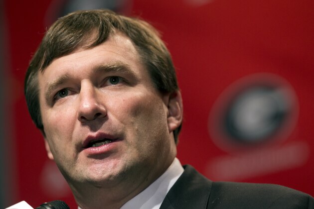 Alabama defensive coordinator Kirby Smart listens to a question from a reporter during a press conference where he was introduced as Georgia's new head football coach  Monday, Dec. 7, 2015, in Athens, Ga. Smart will stay with the Crimson Tide through the NCAA college playoffs. (AP Photo/John Bazemore)