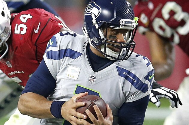 Seattle Seahawks quarterback Russell Wilson (3) is sacked by Arizona Cardinals inside linebacker Dwight Freeney (54) during the second half of an NFL football game, Sunday, Jan. 3, 2016, in Glendale, Ariz. (AP Photo/Rick Scuteri) Seattle Seahawks quarterback Russell Wilson (3) is sacked by Arizona Cardinals inside linebacker Dwight Freeney (54) during the second half of an NFL football game, Sunday, Jan. 3, 2016, in Glendale, Ariz. (AP Photo/Rick Scuteri)