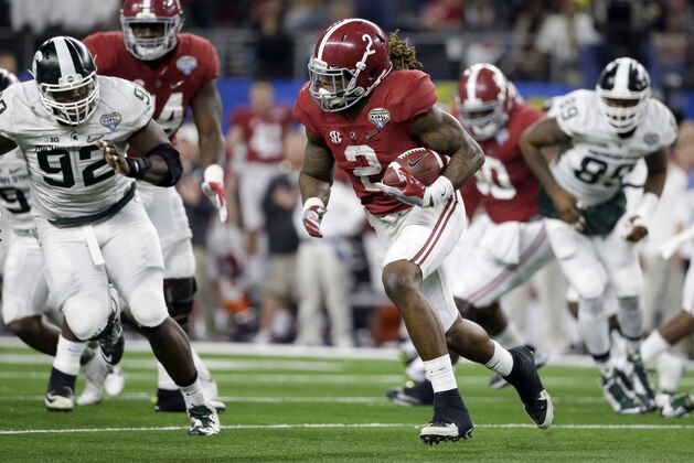 Alabama running back Derrick Henry runs the ball against Michigan State during the first half of the Cotton Bowl NCAA college football semifinal playoff game, Thursday, Dec. 31, 2015, in Arlington, Texas. (AP Photo/Tony Gutierrez) Alabama running back Derrick Henry runs the ball against Michigan State during the first half of the Cotton Bowl NCAA college football semifinal playoff game, Thursday, Dec. 31, 2015, in Arlington, Texas. (AP Photo/Tony Gutierrez)