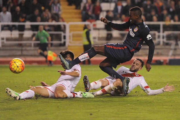 MADRID, SPAIN - DECEMBER 30:  Jackson Martinez of Club Atletico de Madrid gets his shot blocked by Zhang Chengdong of Rayo Vallecano during the La Liga match between Club Atletico de Madrid and Rayo Vallecano de Madrid at Estadio de Vallecas on December 30, 2015 in Madrid, Spain.  (Photo by Denis Doyle/Getty Images)